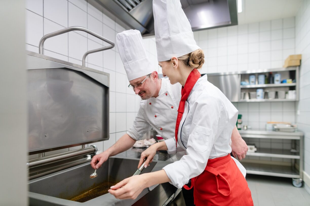 Professional chefs preparing high-quality meals in the care home kitchen.