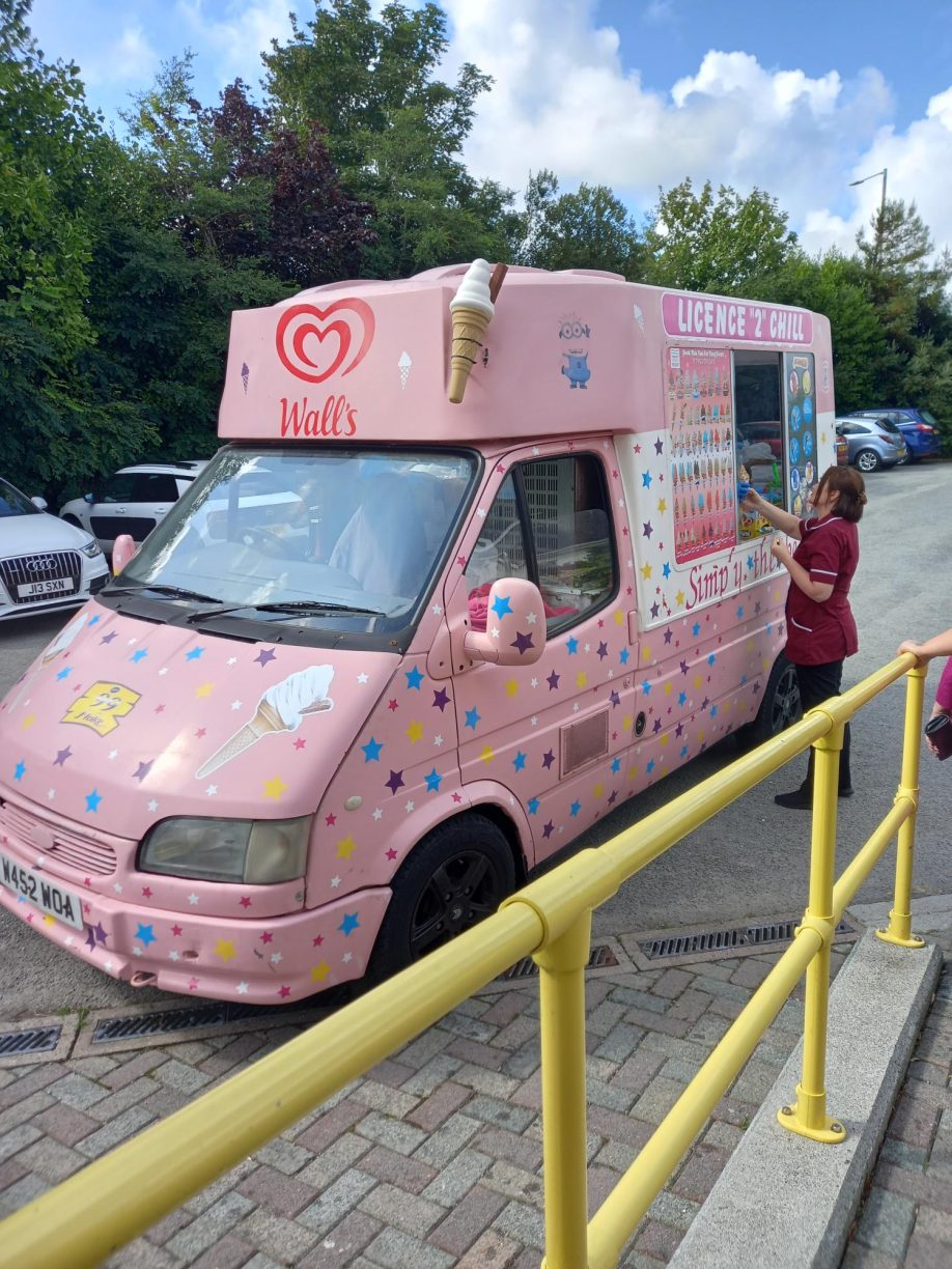 Staff member buying ice cream for the residents in the knitting club